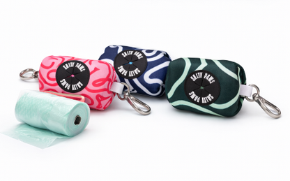 Four colourful pet poop bag dispensers with 'Salty Paws' labels on a white background
